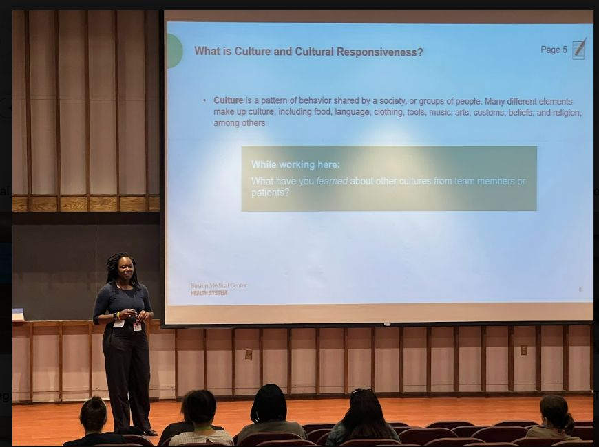 Elevate Impact facilitator presenting on culture and cultural responsiveness to a seated audience
